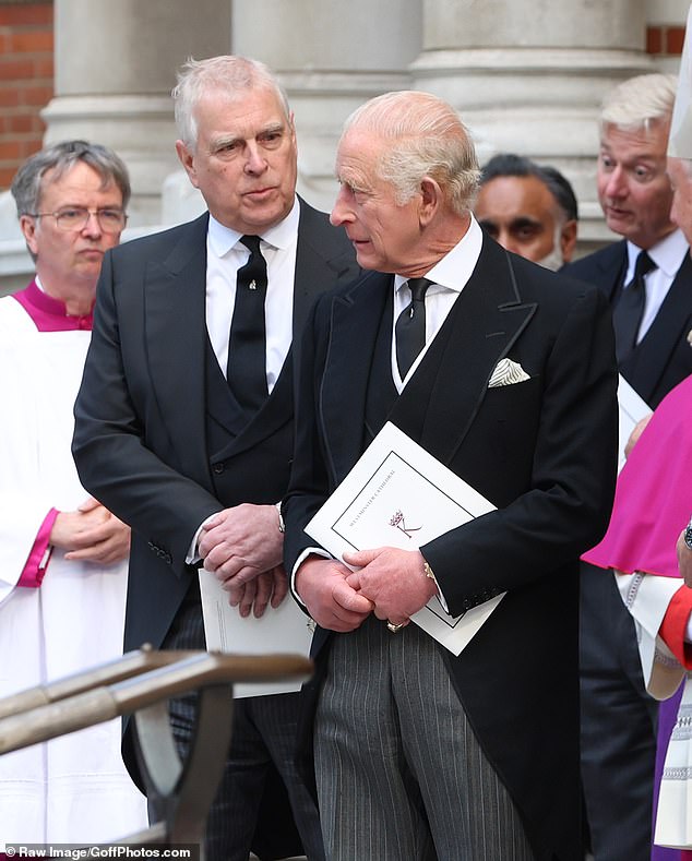 Prince Andrew looks at his brother, King Charles, as they leave the funeral service