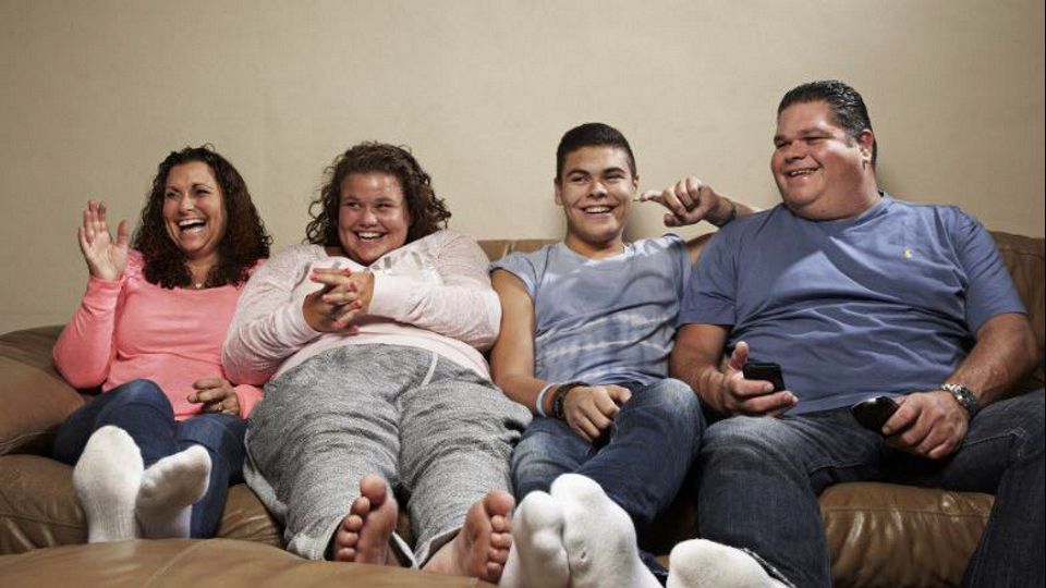 The Tapper family from Gogglebox laughing on a sofa.