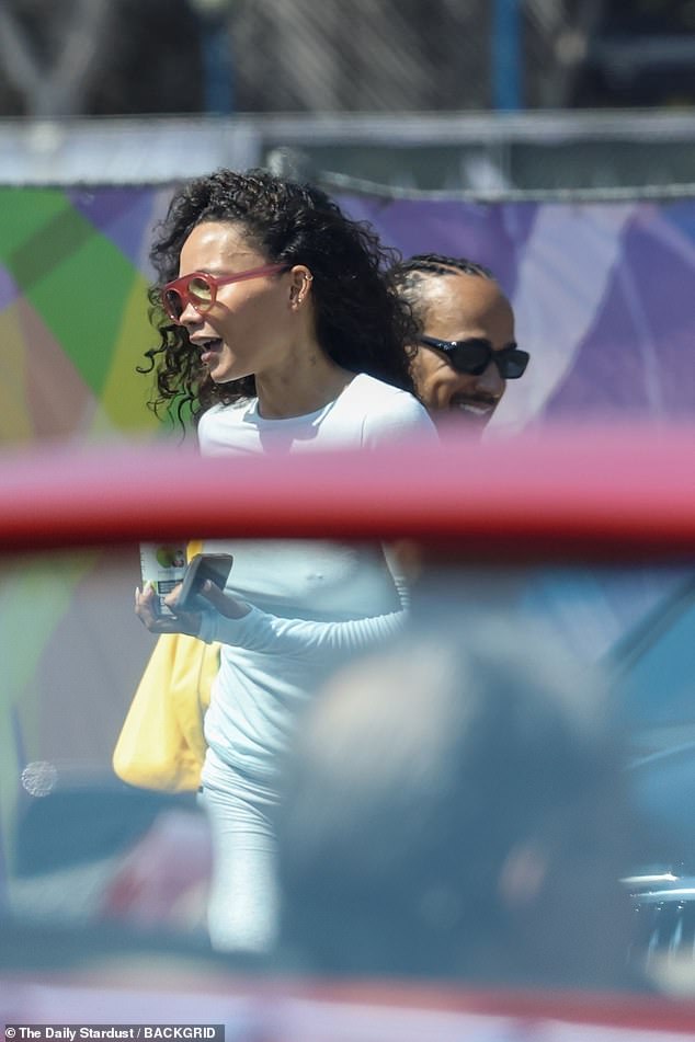 California-born Ashely showed off her figure in a tight light grey co-ord and white flip flops as she stepped out
