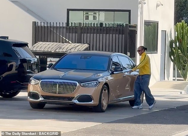 He then hopped back into his swanky car after the meeting