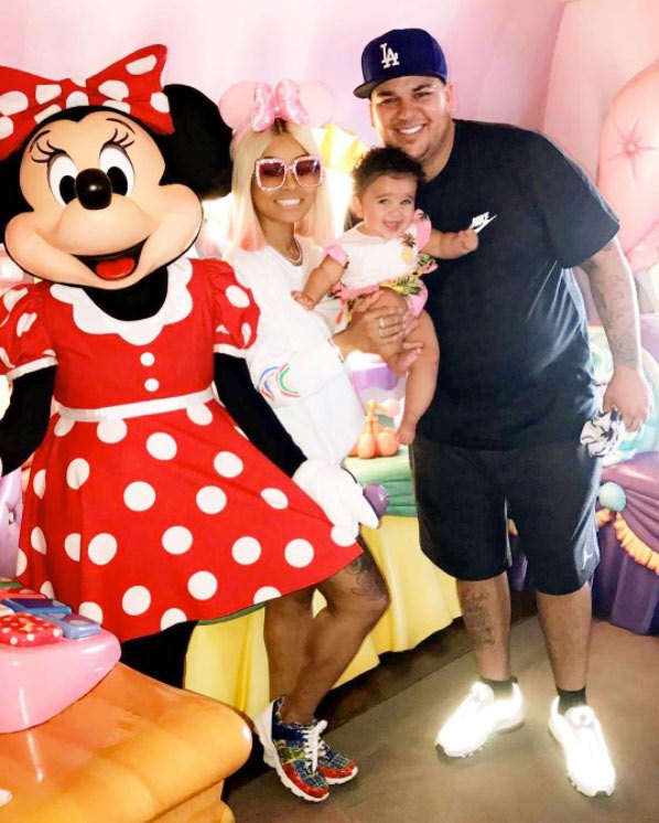 Rob Kardashian, Blac Chyna, and Dream Kardashian pose with Minnie Mouse.