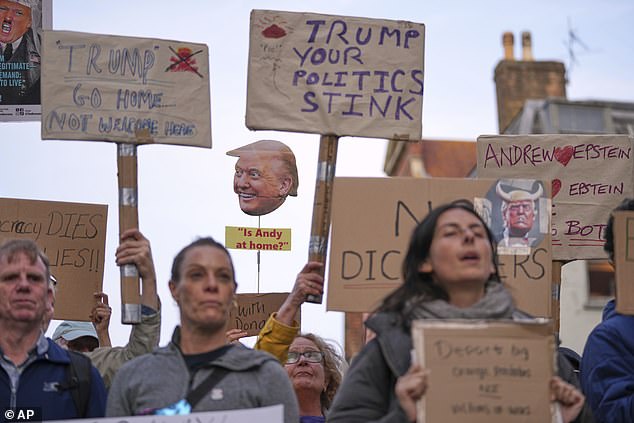 Protestors hold placards reading 'go away, you're polluting Windsor', and 'fascists not welcome'