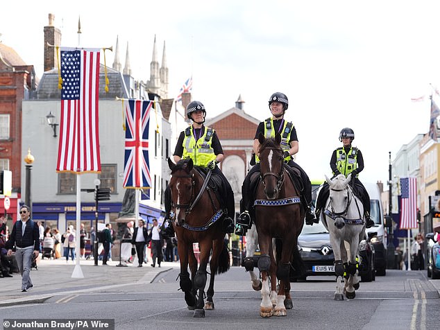 The Union and American flags are seen flying outside Windsor Castle ahead of the visit