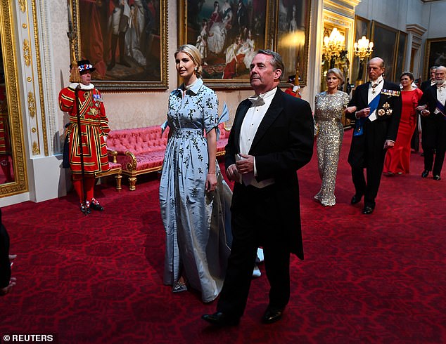 Ivanka Trump (left), who worked as a White House aide during her father's administration, was accompanied by Liam Fox, the secretary of state for international trade, during the 2019 state banquet at Buckingham Palace
