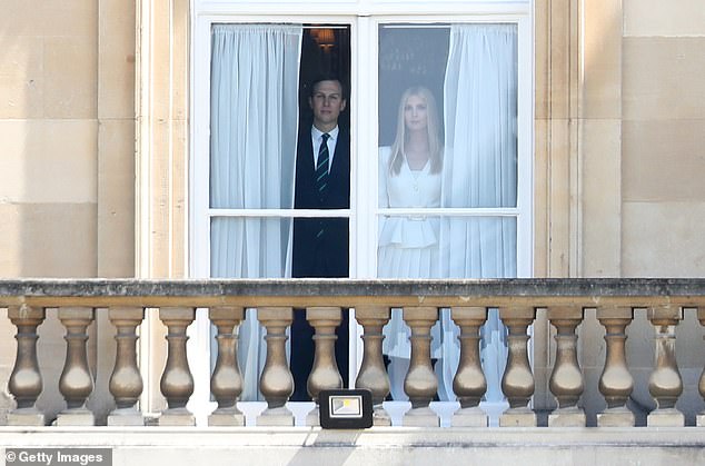 Jared Kushner (left) and Ivanka Trump (right) watch the president and first lady arrive from inside Buckingham Palace during the June 2019 state visit. Melania Trump's ex-aide Stephanie Grisham wrote that 'Javanka' wanted to be part of the official welcoming ceremony