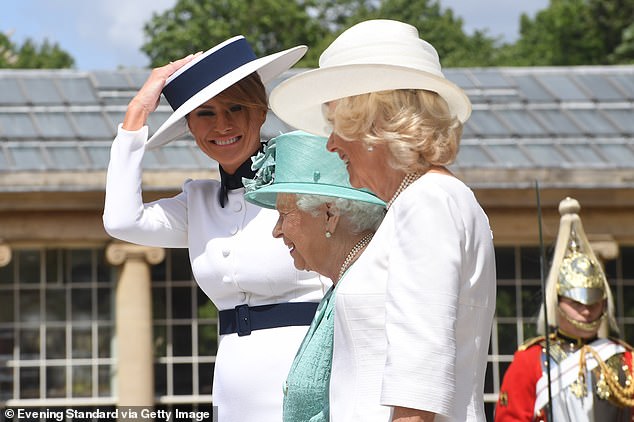 First Lady Melania Trump (left) recalled her hat almost blowing off during an arrival ceremony for the 2019 state visit alongside Queen Elizabeth (center) and Camilla, Duchess of Cornwall (right)
