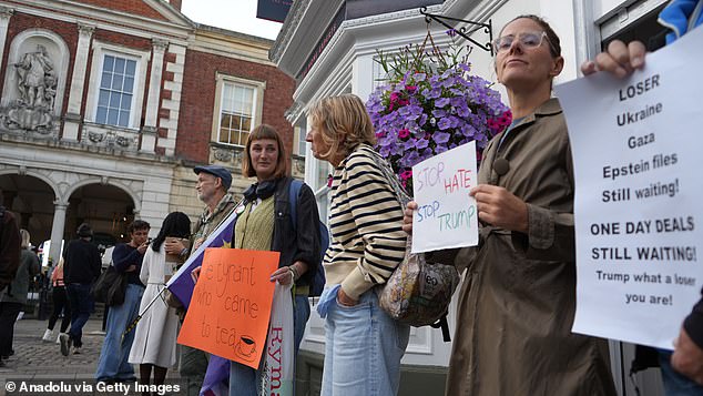Hundreds of protesters gather on Windsor High Street near the castle to oppose US President Donald Trump's arrival in the UK