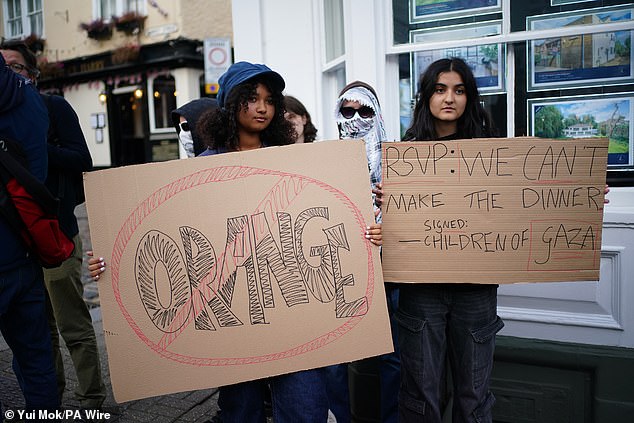 Protesters take part in a demonstration organised by the Stop Trump Coalition outside Windsor Castle