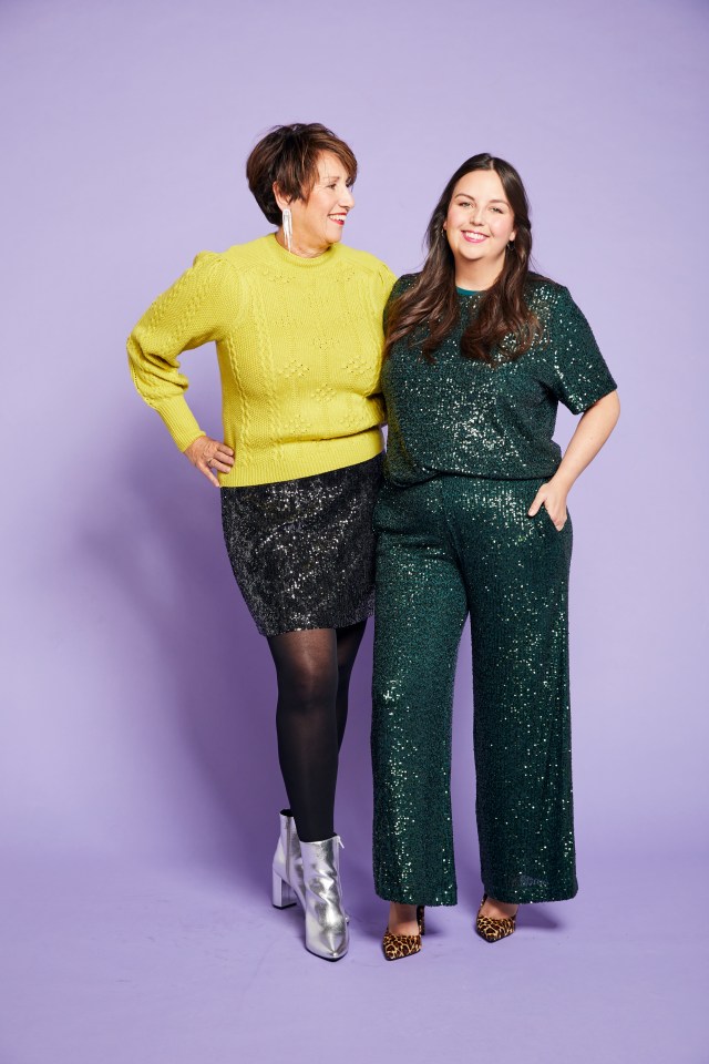 Abby McHale and her mother model Christmas party wear, with Abby in a green sequin top and pants, and her mother in a yellow sweater and black sequin skirt.