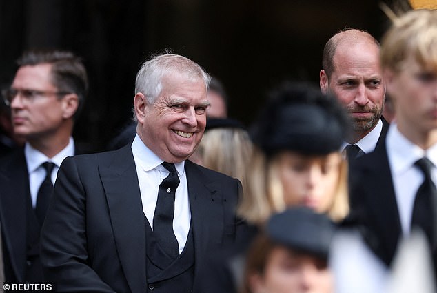 Prince Andrew is seen smiling as he stands next to Prince William