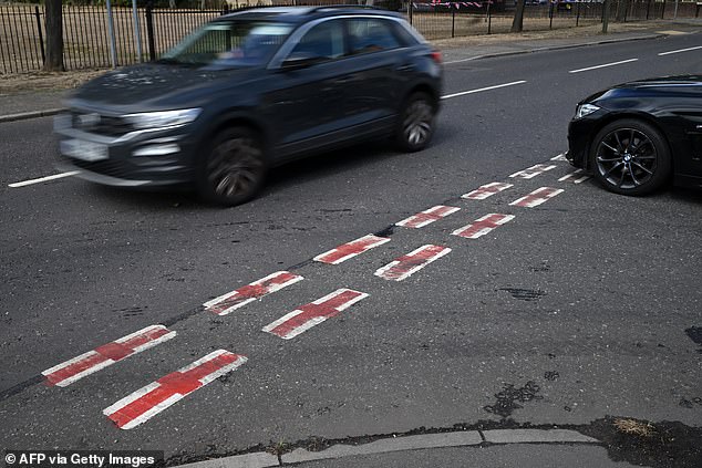 Vandals have also painted the flag on roundabouts and other road markings, to the annoyance of local councils who are having to paint them over again