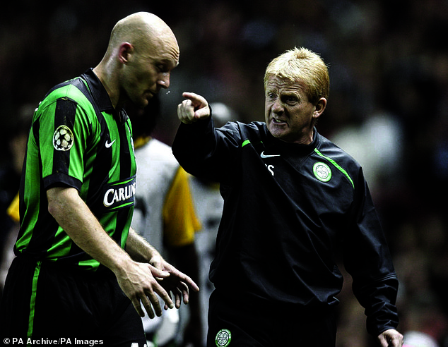 Celtic boss Strachan has a few pointed words for Thomas Gravesen during a Champions League match at Old Trafford