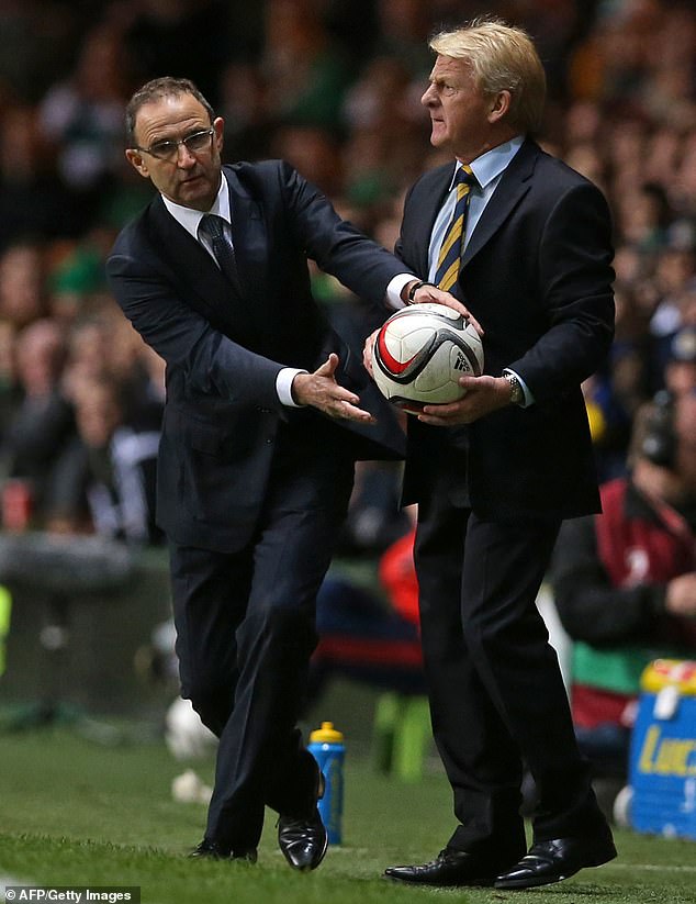 Republic of Ireland boss Martin O'Neill and Scotland counterpart Strachan tussle for the ball during a European qualifier