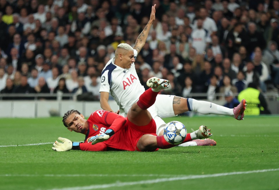 Villarreal's Luiz Junior scoring an own goal under pressure from Tottenham Hotspur's Richarlison.