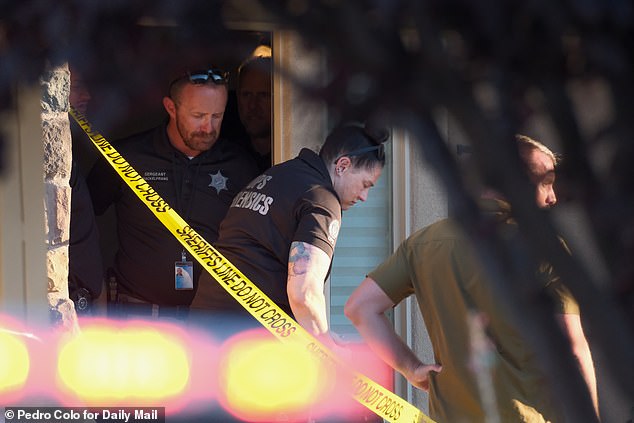 Investigators are seen here searching Robinson's St George, Utah home on Friday