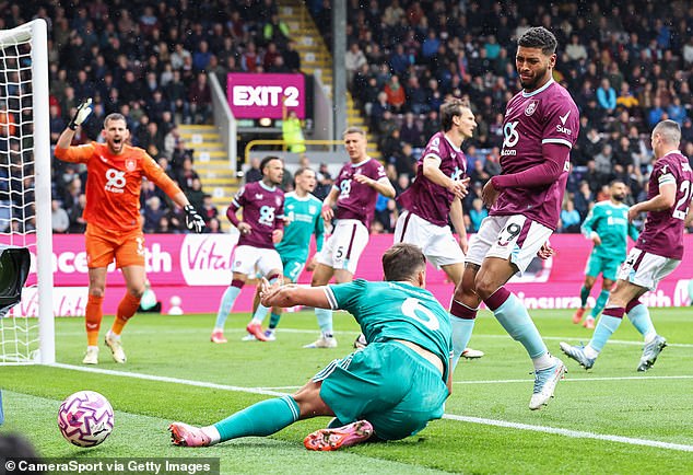 Burnley players protest after Kerkez falls to the floor in search of a penalty at Turf Moor