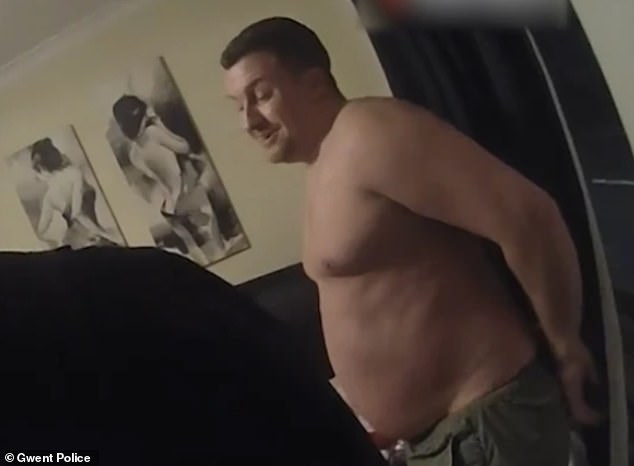 Andrews laughed while officers arrest him during a dawn raid on his Newport home