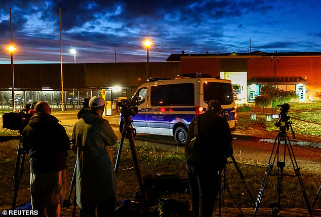Members of the media wait in front of a prison facility, where Christian Brueckner is being held ahead of his expected release in Sehnde, Germany, September 17