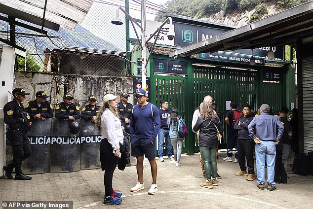 Tourism Minister Desilu Leon announced on a local radio station that 1,400 tourists, who were stranded at a train station, had been evacuated on Monday night (pictured: tourists stranded on Tuesday)