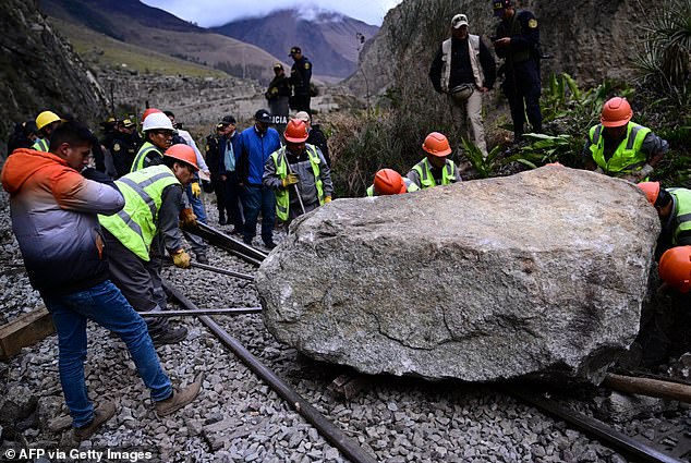 This service halt is the result of demonstrators covering the route in the mountainous Cusco region with rocks and logs (pictured: a rock placed by rioters on the tracks in 2022)