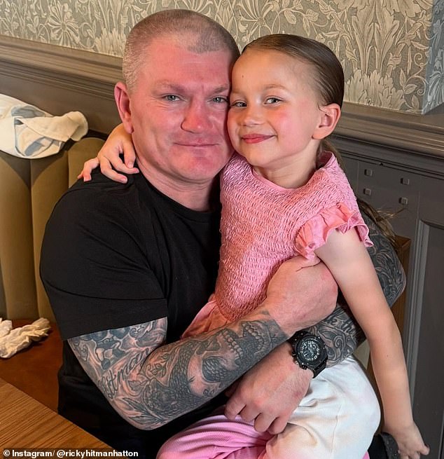 Hatton proudly holds his granddaughter Lyla, the daughter of his son Campbell