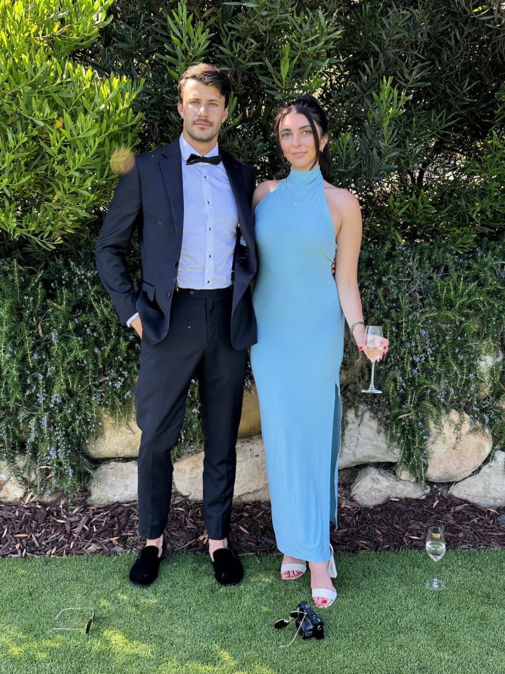 Emily Robbie and her husband Tyler dressed for an event.