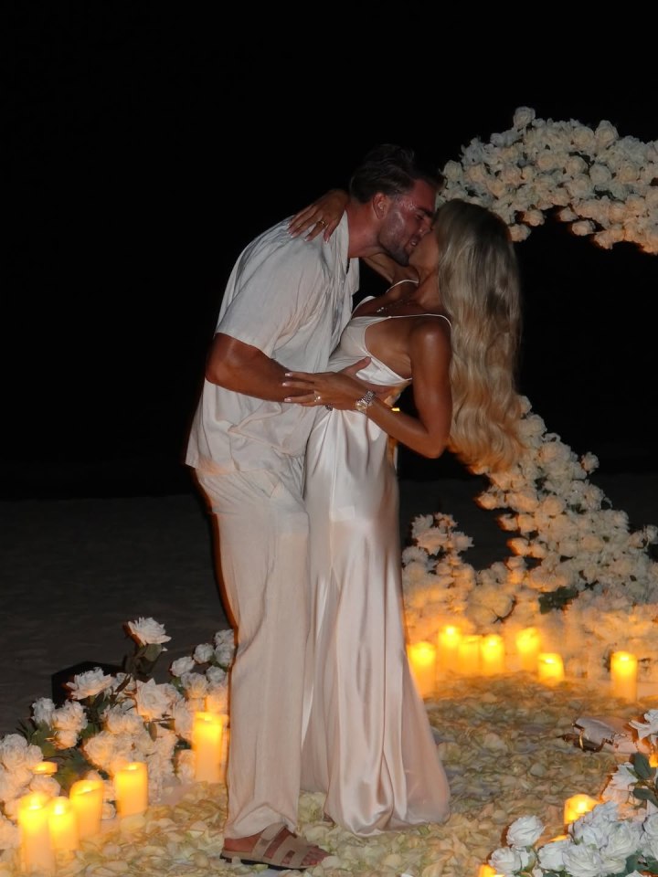 Molly Smith and Tom Clare kissing at their engagement.