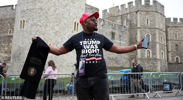 A supporter of U.S. President Donald Trump stands outside Windsor Castle on the day of the state visit of the U.S. President and first lady Melania Trump, in Windsor, Britain, September 17, 2025. REUTERS/Phil Noble