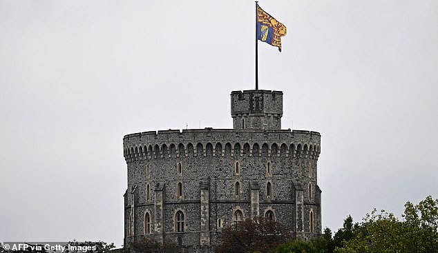 The Royal Standard flag flies atop the Round Tower at Windsor Castle, in Windsor, on September 17, 2025, during US President Donald Trump's second State Visit to the UK. US President Donald Trump arrived in Britain on Tuesday for an unprecedented second state visit, with the UK government rolling out a royal red carpet welcome to win over the mercurial leader. (Photo by Paul ELLIS / AFP) (Photo by PAUL ELLIS/AFP via Getty Images)