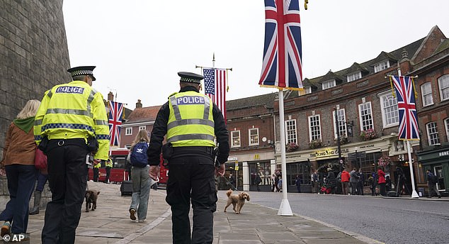 Police officers patrol in Windsor, England, Wednesday, Sept. 17, 2025 ahead of the arrival of President Donald Trump.(AP Photo/Alberto Pezzali)