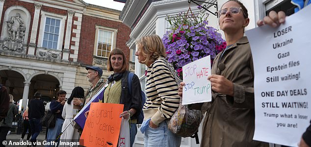 WINDSOR, UNITED KINGDOM - SEPTEMBER 16: Hundreds of protesters gather on Windsor High Street near the castle to oppose US President Donald Trump's arrival in the UK on September 16, 2025 in Windsor, United Kingdom. The demonstrators carried banners, chanted slogans against Trump's policies saying "Trump out!" and marched through the streets. US President Donald Trump is paying three-day state visit to the UK, following an invitation extended by King Charles in February during Prime Minister Keir Starmer's visit to Washington, DC. (Photo by Yunus Dalgic/Anadolu via Getty Images)