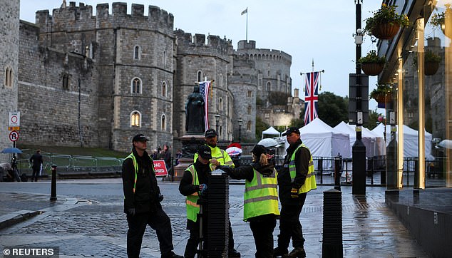 Police officers stand on duty at Windsor Castle, on the day of the state visit of U.S. President Donald Trump and First Lady Melania Trump to the UK, in Windsor, Britain, September 17, 2025. REUTERS/Phil Noble