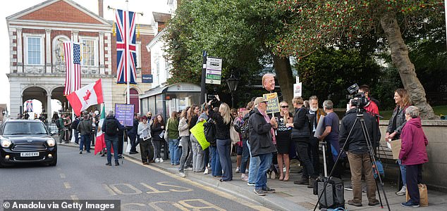 WINDSOR, UNITED KINGDOM - SEPTEMBER 16: Hundreds of protesters gather on Windsor High Street near the castle to oppose US President Donald Trump's arrival in the UK on September 16, 2025 in Windsor, United Kingdom. The demonstrators carried banners, chanted slogans against Trump's policies saying "Trump out!" and marched through the streets. US President Donald Trump is paying three-day state visit to the UK, following an invitation extended by King Charles in February during Prime Minister Keir Starmer's visit to Washington, DC. (Photo by Yunus Dalgic/Anadolu via Getty Images)