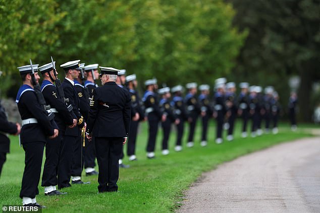 The Royal Navy Ceremonial Guard line up on the carriage procession route in Windsor today
