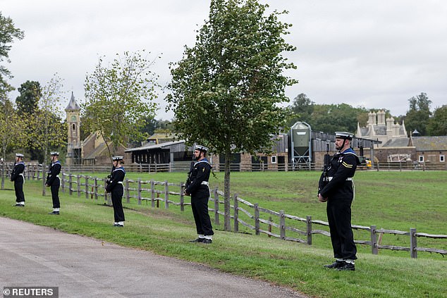 The Royal Navy Ceremonial Guard line up on the carriage procession route in Windsor today