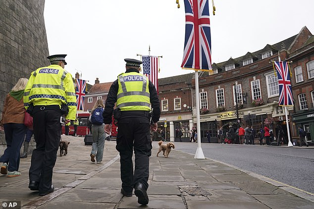 Police officers patrol in Windsor this morning as the state visit gets underway