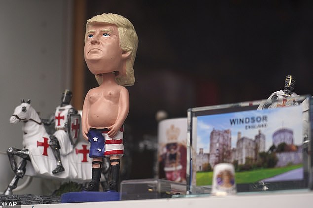A figurine of Donald Trump is displayed for sale in the window of a shop in Windsor today