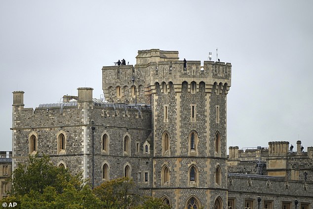 Security forces stand on the roof of Windsor Castle today ahead of President Trump's arrival