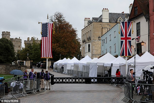 Members of the media stand outside Windsor Castle this morning to cover the state visit