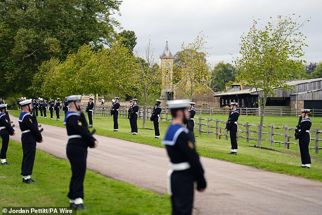 The Royal Navy Ceremonial Guard line up on the carriage procession route in Windsor today