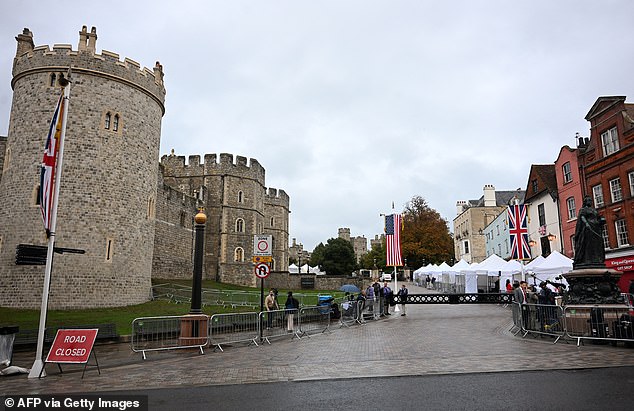 Media crews stand outside Windsor Castle this morning as the state visit gets underway