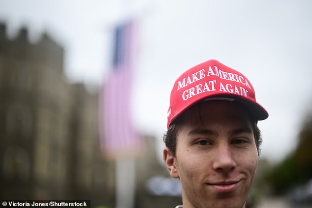 A supporter of US President Donald Trump stands outside Windsor Castle this morning