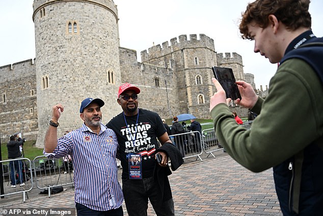 Trump supporter Augustine Chukwuma Obodo (right) outside Windsor Castle this morning