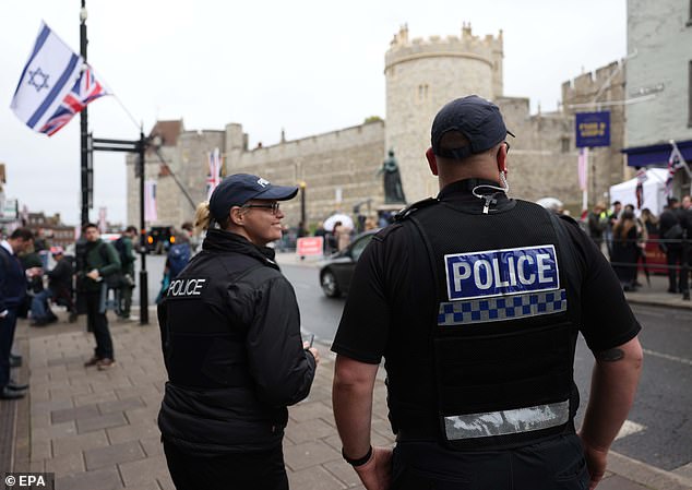 Police officers patrol in Windsor this morning as the state visit gets underway
