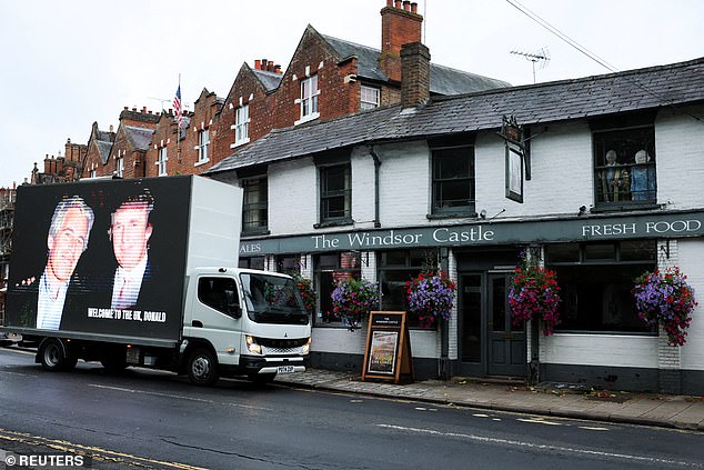 An image of Donald Trump alongside Jeffrey Epstein is displayed on a vehicle in Windsor today