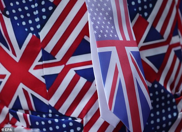 A person wears US and UK flag themed clothing at Windsor Castle this morning