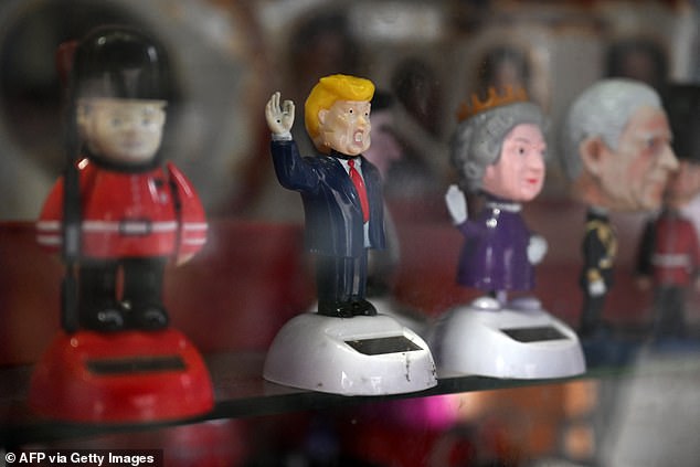 Royal-themed souvenirs and one of US President Donald Trump are on sale in Windsor today