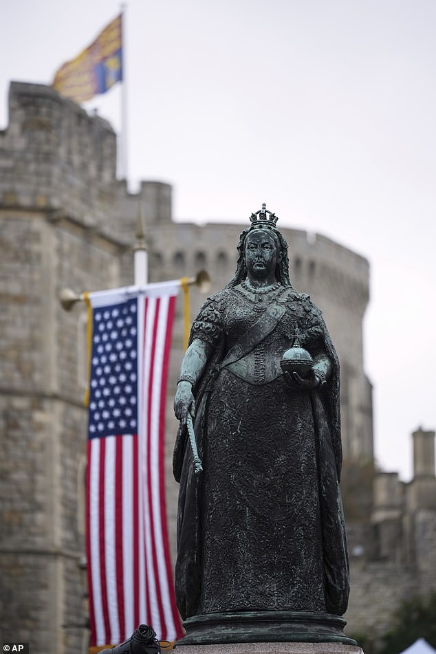 The Queen Victoria Statue next to the flag of the United States of America in Windsor today