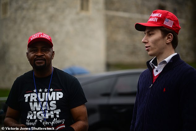 Supporters of US President Donald Trump stand outside Windsor Castle this morning