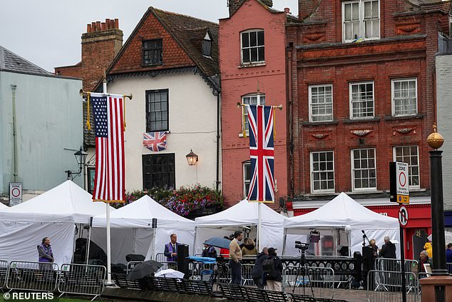 Media crews stand outside Windsor Castle this morning as the state visit gets underway